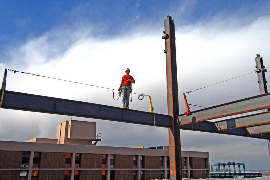 Steel worker atop 9th floor beam :  : Christopher Davies Photography