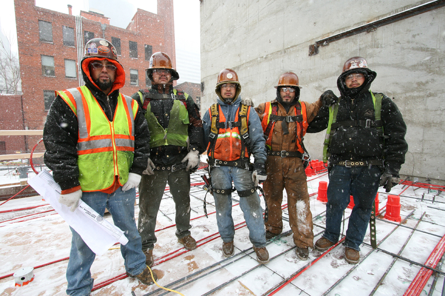 Structural workers getting ready to pour the first floor in a snow storm :  : Christopher Davies Photography