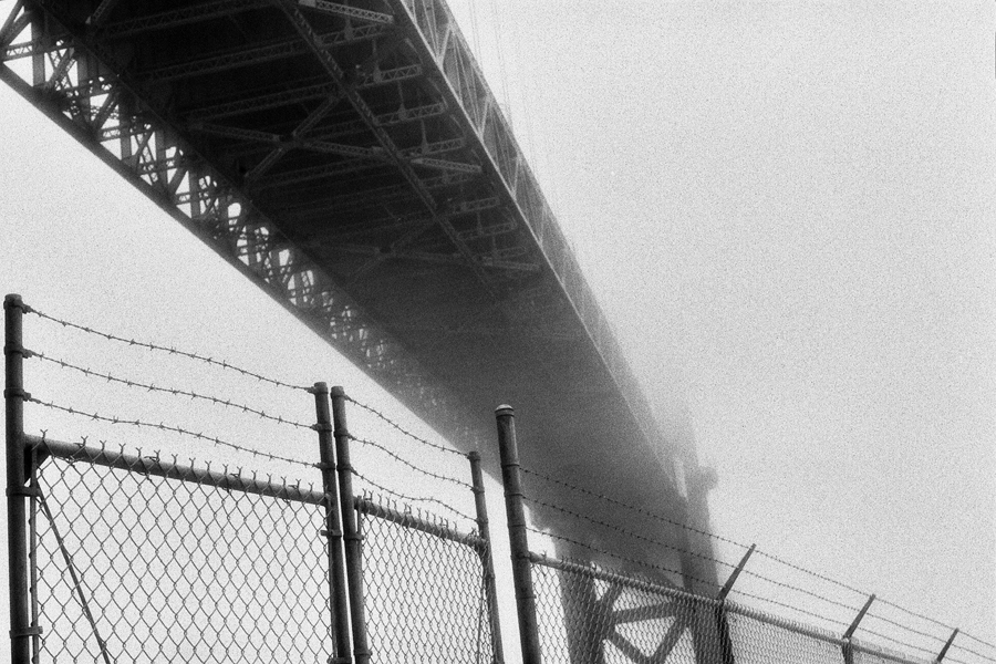 Under girders & fence at The Golden Gate Bridge. Kodak Black & White Infrared Film(C)1995 :  : Christopher Davies Photography